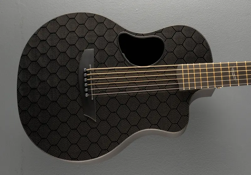 Carbon Fiber Travel Guitar – Honeycomb Pattern with Gold Accents